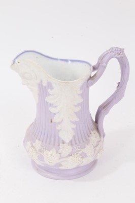 Lot 72 - Collection of nine 19th century relief moulded lilac-ground jugs, mostly Samuel Alcock, including the Portland Jug, Naomi and her Daughters in Law, etc, the largest measuring 29cm height