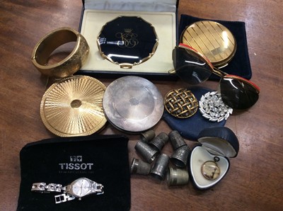 Lot 652 - Vintage compacts, pair vintage sunglasses, thimbles, gold plated bangle, Tissot wristwatch and bijouterie