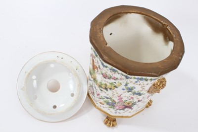 Lot 119 - 19th century French porcelain bough pot, the faceted body with moulded masks and four lion's paw feet, decorated with various flora and fauna, the cover with openings for flower stems, 23cm height