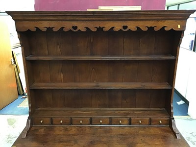 Lot 852 - Good quality reproduction dresser with plate rack above an assortment of draws and cupboards