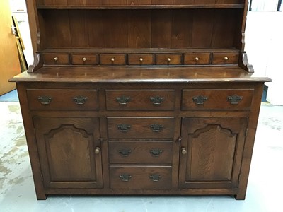 Lot 852 - Good quality reproduction dresser with plate rack above an assortment of draws and cupboards