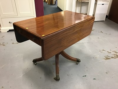 Lot 856 - Mahogany pembroke table with end draw on paw feet with brass castors