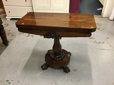 Lot 857 - William IV  Rosewood card table with fold over top and circular base with carved claw feet