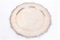 Lot 554 - Peruvian white metal dining plate of circular...