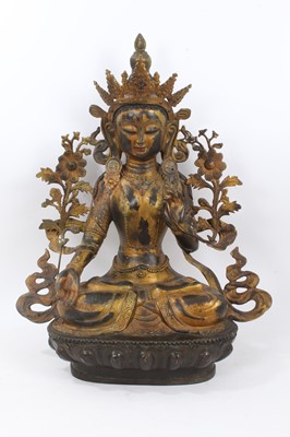 Lot 301 - Tibetan gilt bronze  figure of a seated goddess