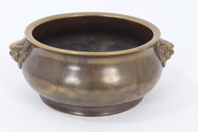 Lot 157 - 18th / 19th century Chinese bronze censer with lion mask handles, six-character Xuande mark to base
