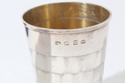 Lot 49 - Late Victorian Silver collapsible cup of tapered cylindrical form with engraved initials on reeded circular foot, in velvet lined fitted case