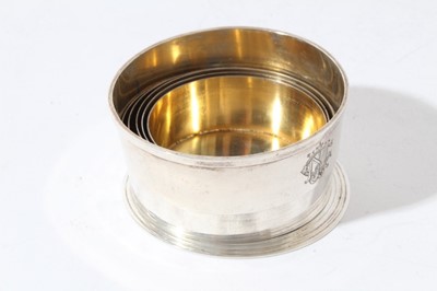 Lot 49 - Late Victorian Silver collapsible cup of tapered cylindrical form with engraved initials on reeded circular foot, in velvet lined fitted case