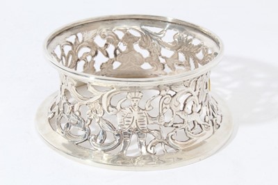 Lot 88 - George V silver dish ring of conventional form with pierced decoration depicting people and animals, (London 1921), makers mark rubbed, all at approximately 3oz, 11cm in diameter