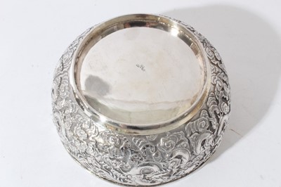 Lot 39 - Good quality late 19th century Chinese Export silver bowl with embossed decoration depicting Dragons amongst clouds, marks to base for Wang Hing