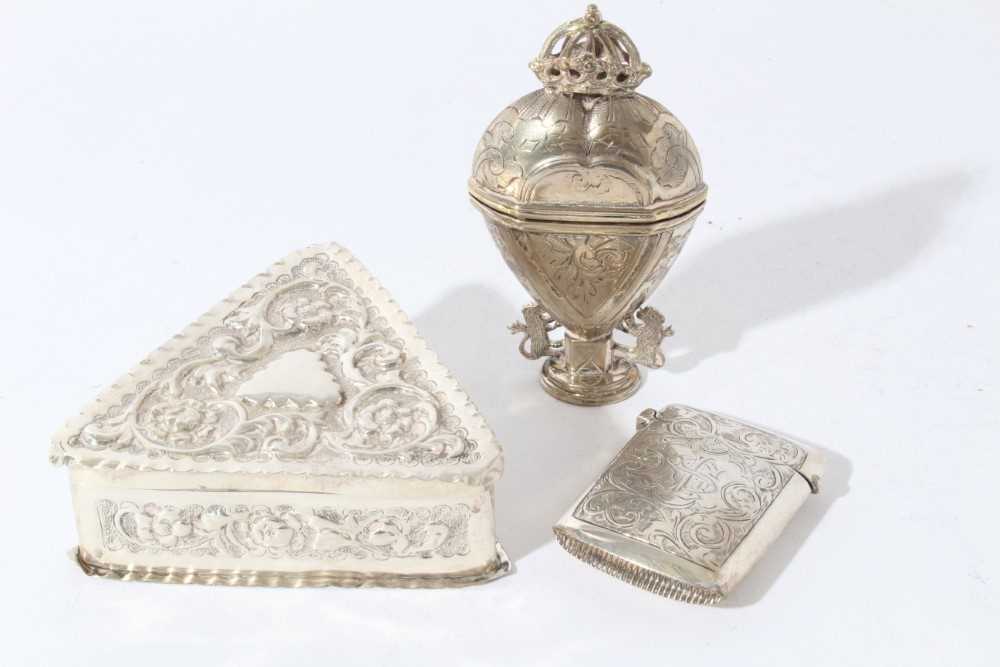 Lot 87 - Victorian silver trinket box of triangular form with embossed decoration (London 1885), together with a silver vesta case and a 19th century Continental white metal