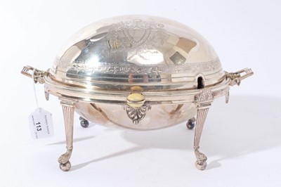 Lot 113 - Late 19th/early 20th century silver plated revolving breakfast dish of typical form, with engraved decoration, twin reede handles and separate pierced drainer, on four reeded legs