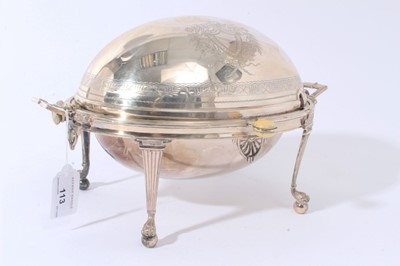 Lot 113 - Late 19th/early 20th century silver plated revolving breakfast dish of typical form, with engraved decoration, twin reede handles and separate pierced drainer, on four reeded legs