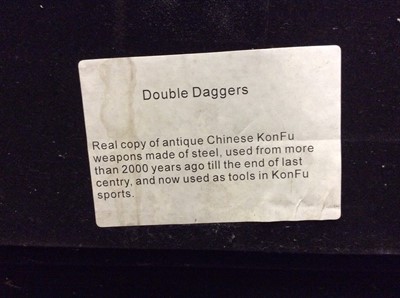 Lot 429 - Two Chinese replica KonFu steel weapons mounted in glazed box frame