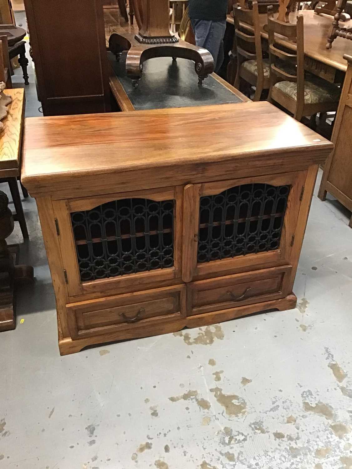 Lot 892 - Elm television cabinet with wrought metal doors