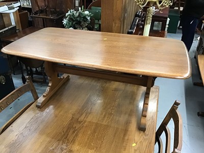 Lot 876 - Ercol elm coffee table on end standards 128 cm long