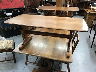 Lot 877 - Ercol elm coffee table on shaped end standards 129 cm