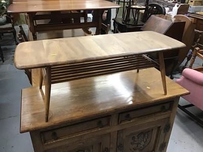 Lot 879 - Ercol elm coffee table with undertier 104 cm