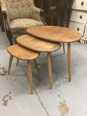 Lot 881 - Nest three Ercol elm pebble tables