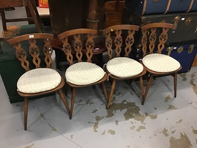 Lot 882 - Four Ercol Prince of Wales feather back dining chairs