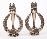 Lot 582 - Pair silver standing emblems in the form of a...