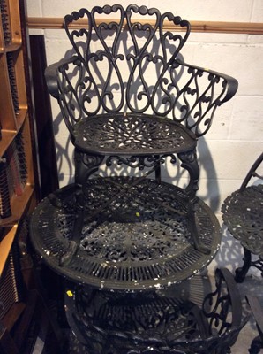 Lot 1042 - Cast iron garden table with four chairs