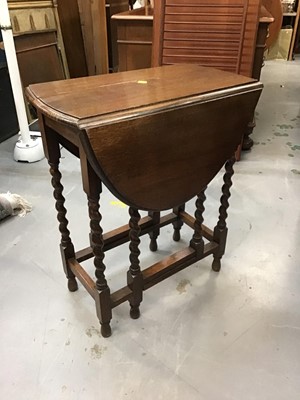 Lot 886 - 1920s oak oval dropleaf table on spiral twist legs