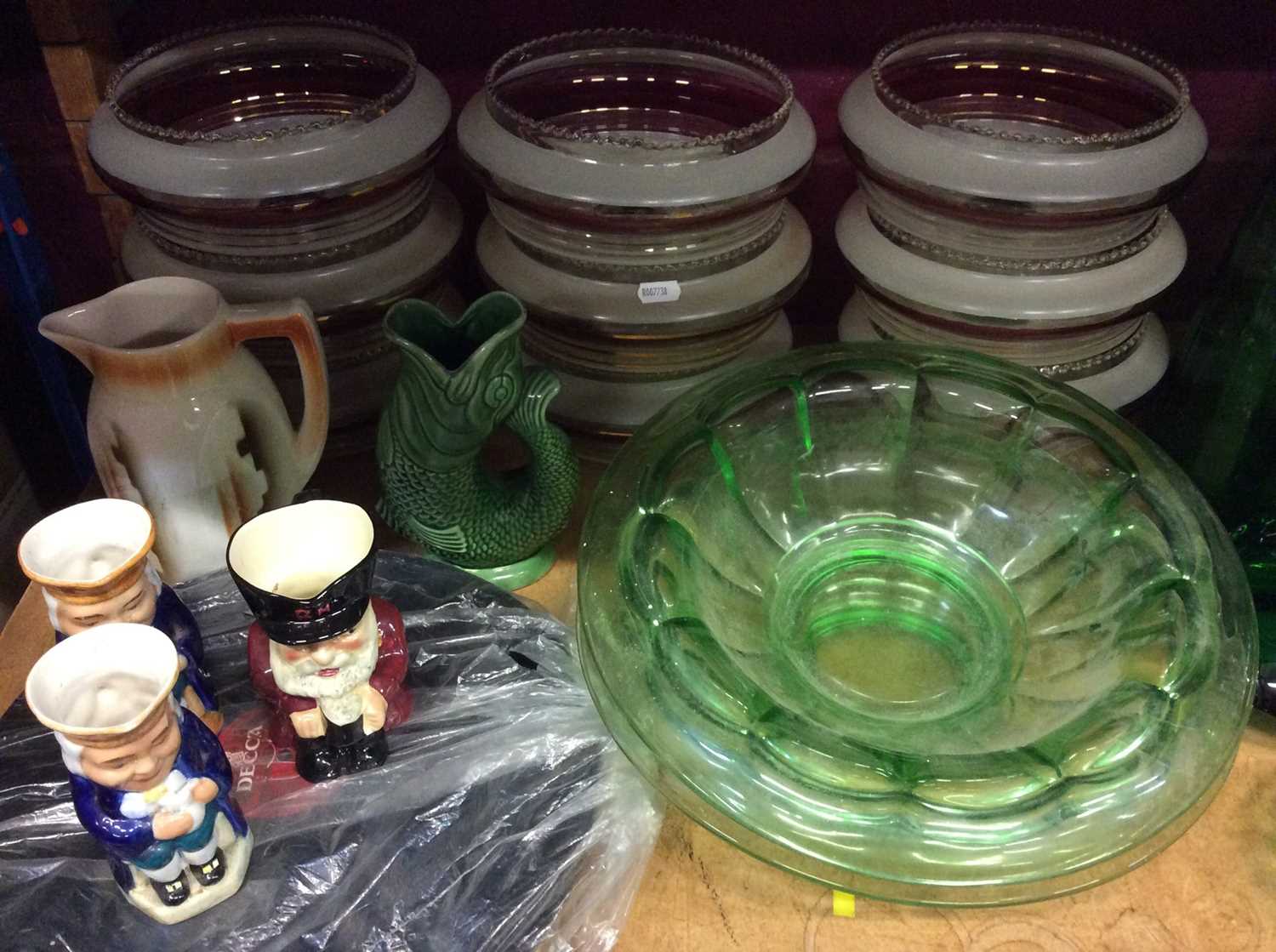 Lot 579 - Nine glass light shades, green glassware, glug jug, three character jugs etc