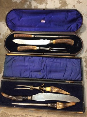 Lot 467 - Three piece carving set with horn handles in velvet liner fitted case, together with another similar (2 sets)