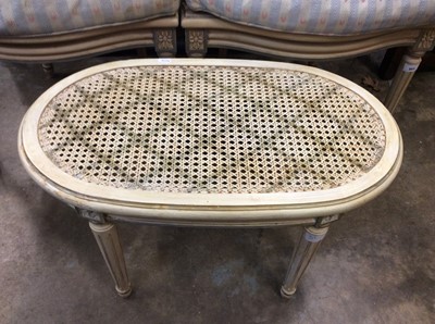 Lot 965 - Pair of painted open armchairs with caned backs and loose cushions in Bernard Thorp fabric, together with an oval stool