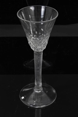 Lot 169 - Georgian wine glass, c.1755, the hammered pointed round funnel bowl on a fine incised twist stem, on a conical foot