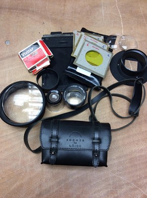 Lot 404 - Bogner for Leica black leather camera case, together with camera accessories