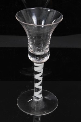 Lot 153 - 18th century continental opaque twist wine glass, the bell bowl over a stem consisting of a heavy spiral band, above a conical foot
