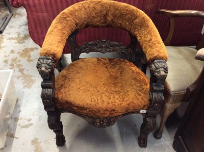 Lot 916 - Victorian carved oak framed tub chair with golden brown upholstery and carved grotesque mask terminals