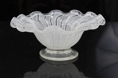 Lot 154 - Small continental, probably Venetian, footed latticino glass dish with wavy rim, rough pontil mark to base, 10cm diameter