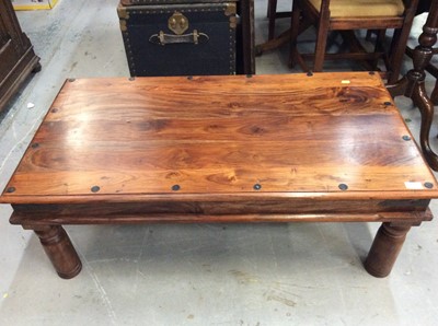 Lot 921 - Hard wood coffee table with iron strap work. 110cm x 59.5cm