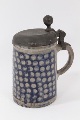 Lot 86 - An 18th Century Westerwald stoneware tankard, with hinged pewter cover