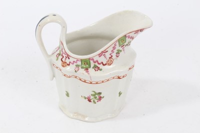 Lot 141 - A rare Keeling and Co Low Bucket Shaped cream jug, circa 1795, pattern number 292, and four helmet shaped cream jugs, circa 1795