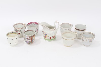 Lot 173 - A Keeling type helmet shaped cream jug, decorated in famille rose palette, circa 1795, and various coffee cups