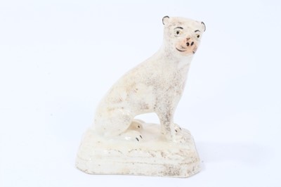 Lot 31 - An unusual English porcelain model of a seated lioness, circa 1830-40