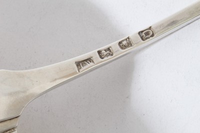 Lot 8 - George III silver old english pattern serving ladle with feather edge, engraved crest and scalloped bowl (London 1769), 6.5oz, 35cm in length