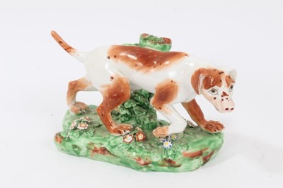 Lot 95 - Late 18th century Derby porcelain model of a Pointer, shown mid-stride on a grassy base, 16cm length from head to tail