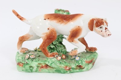 Lot 95 - Late 18th century Derby porcelain model of a Pointer, shown mid-stride on a grassy base, 16cm length from head to tail