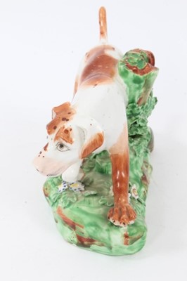 Lot 108 - Late 18th century Derby porcelain model of a Pointer, shown mid-stride on a grassy base, 16cm length from head to tail