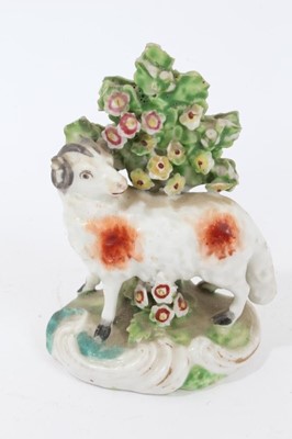 Lot 111 - Pair late 18th century Derby porcelain models of sheep, shown standing on scrollwork bases, with bocage behind them and to the bases, 9.5cm height