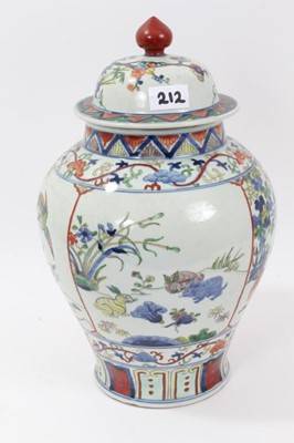 Lot 212 - Pair of Chinese Famille verte baluster vases and covers, each with six character Jiajing mark