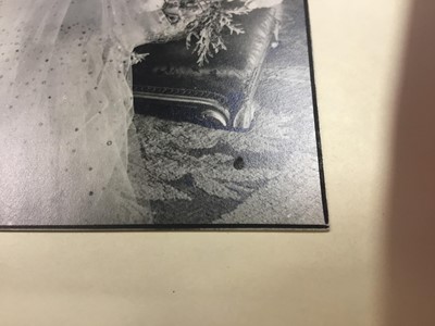 Lot 54 - H.M. Queen Elizabeth , fine 1939 Cecil Beaton black and white portrait photograph - The Queen wearing a beautiful sequinned ball gown and jewels with a painted classical garden scene backdrop, moun...