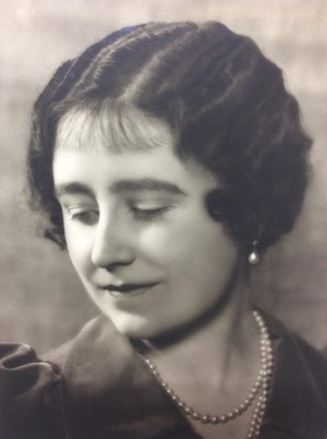 Lot 56 - H.M. Queen Elizabeth , fine late 1930s Dorothy Wilding black and white informal portrait photograph of The Queen wearing pearls , with tissue and card mount, signed by the photographer and label ve...