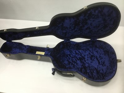 Lot 9 - Hard guitar case by Paxman, black finish, together with another Paxman guitar case with blue velvet lining, one other hard guitar case