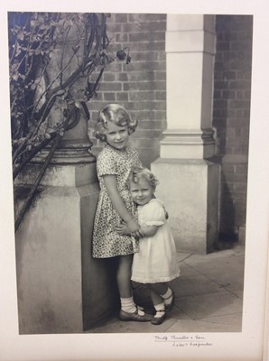 Lot 59 - Princess Elizabeth ( later H.M. Queen Elizabeth II ) and Princess Margaret Rose, charming 1932 Frederick Thurston black and white photograph of the young Princesses hugging one another , mounted on...
